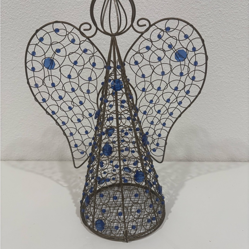 Wire angel with plastic beads opens in the bottom